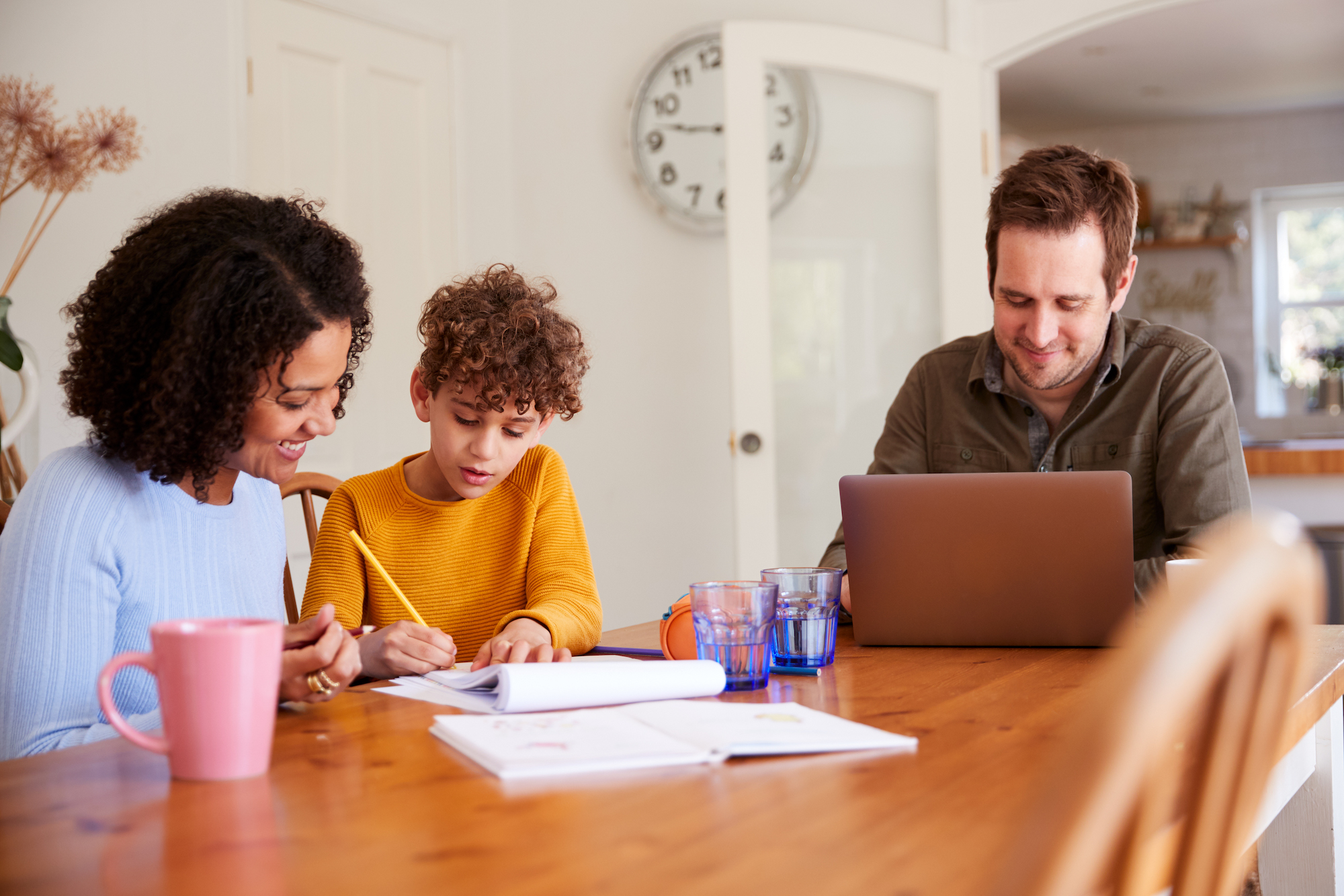 Mom and dad measuring their child's progress in Applied Behavior Analysis Therapy